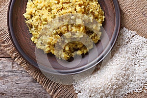 Khichdi close-up on a plate with ingredients. top view