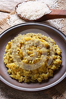 Khichdi close-up on a plate top view vertical