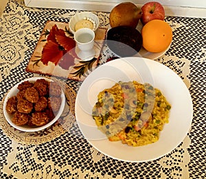 Khichuri with mixed vegetables, fruit and laddu