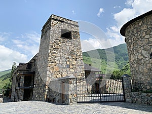 Khidikus. Ancestral tower of Gusov family, 17th century, was restored in 2010. Alan dormition monastery. Russia, North Ossetia, Fi