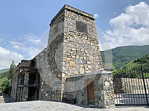 Khidikus. Ancestral tower of Gusov family, 17th century, was restored in 2010. Alan dormition monastery. Russia, North Ossetia, Fi