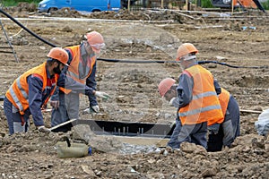 Workers at the construction site concrete foundation