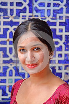 KHIVA, UZBEKISTAN - MAY 4, 2011: Portrait of a beautiful Uzbek young woman at Tosh Hovli palace