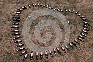 Khmelnytskyi, Ukraine - July 03 2022: Heart made of hoppy beer bottles. Love of alcoholic beverages, fun and alcoholism