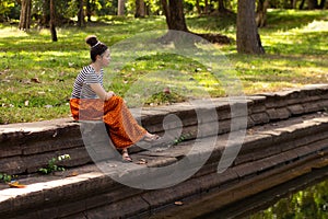 Khmer Asian Girl by Ancient Pool in Angkor Thom, Cambodia