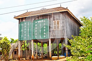 Khmer traditional wooden house, most of them is blue coloured, Klong Duan Keo, Takeo, Cambodia