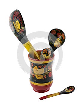 Khokhloma spoon of different sizes in a vase