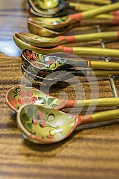 Khokhloma spoons on wooden table