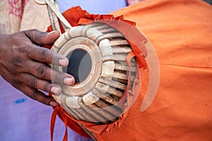 The khol or mridangam is being played by a devotee