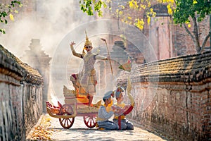 Khon or traditional Thai classic masked from the Ramakien as character of princess or king dance on traditional chariot also hold