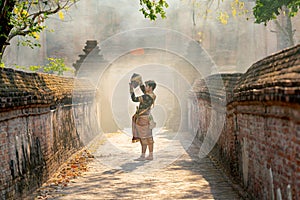 Khon or traditional Thai classic masked from the Ramakien characters as black monkey dance in front of ancient building and stay