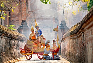 Khon or traditional Thai classic masked from the Ramakien characters woman and blue monkey stay together on traditional chariot in photo
