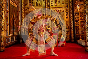 Khon or traditional Thai classic masked from the Ramakien monkey and red giant characters action of dance in front of Thai