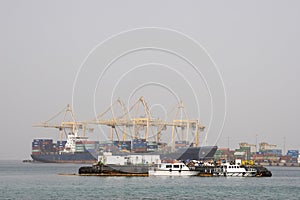 Khor Fakkan UAE Large cargo ships docked to load and unload goods at Khor Fakkport