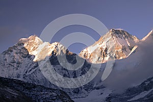Khumbutse and Changtse mountain peaks in Himalayas at sunset
