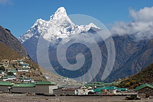 Khumjung village and Ama Dablam (6814 m) peak in Nepal photo