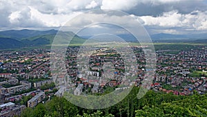Khust (Ukraine) - panoramic city view. and dark clouds before the storm and mountains behind on the background