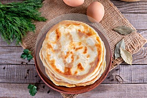 Khychiny - traditional caucasian flatbread filled with cheese and herbs