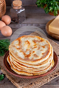 Khychiny - traditional caucasian flatbread filled with cheese and herbs