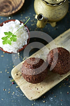 Kibbeh, a levantine dish, on a rustic wooden table