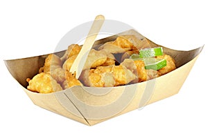 Kibbeling in a cardboard tray isolated on white background.