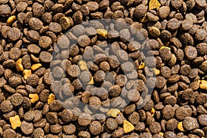 Kibble for pets, small brown pieces.