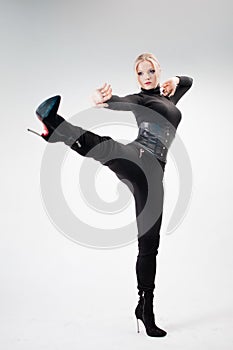 Kick, attack or aggression, concept. A young woman photo