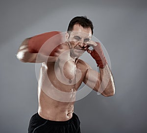 Kickbox fighter on gray background