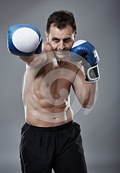 Kickbox fighter on gray background