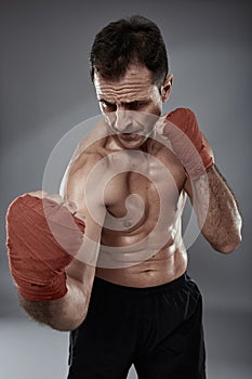 Kickbox fighter on gray background
