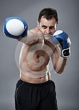 Kickbox fighter on gray background