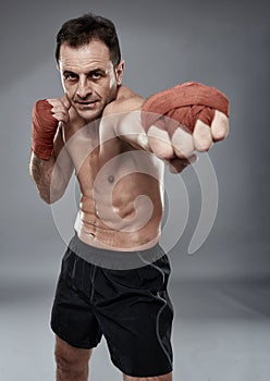 Kickbox fighter on gray background