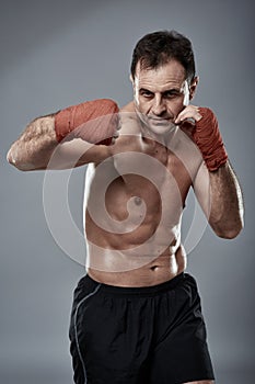 Kickbox fighter on gray background