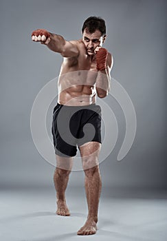 Kickbox fighter on gray background