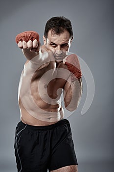 Kickbox fighter on gray background