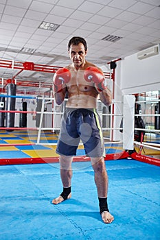 Kickbox fighter shadow boxing in the ring