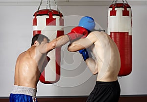 Kickbox fighters sparring in the gym