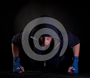 Kickboxer doing push-up on his fists