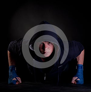 Kickboxer doing push-up on his fists