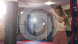 Kickboxer girl in the gym. Sports girl. Kickboxing concept. Women`s martial arts