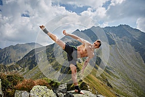 Kickboxer or muay thai fighter training on a mountain