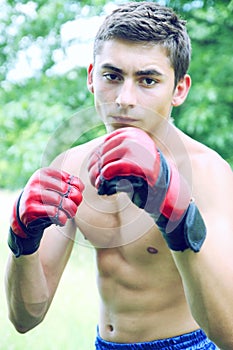 Kickboxer in red gloves