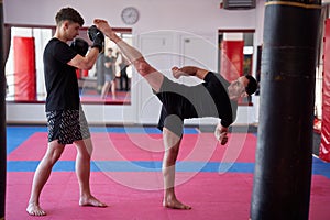 Kickboxers sparring in the gym