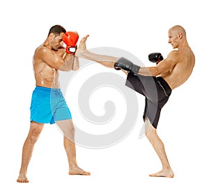 Kickboxers sparring on white