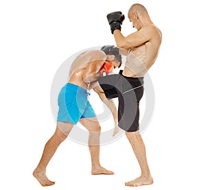 Kickboxers sparring on white