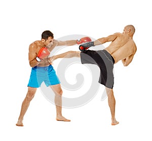 Kickboxers sparring on white