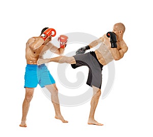 Kickboxers sparring on white