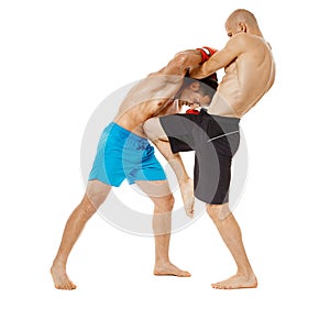 Kickboxers sparring on white