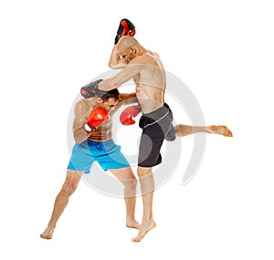 Kickboxers sparring on white