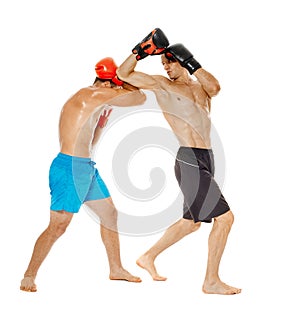 Kickboxers sparring on white